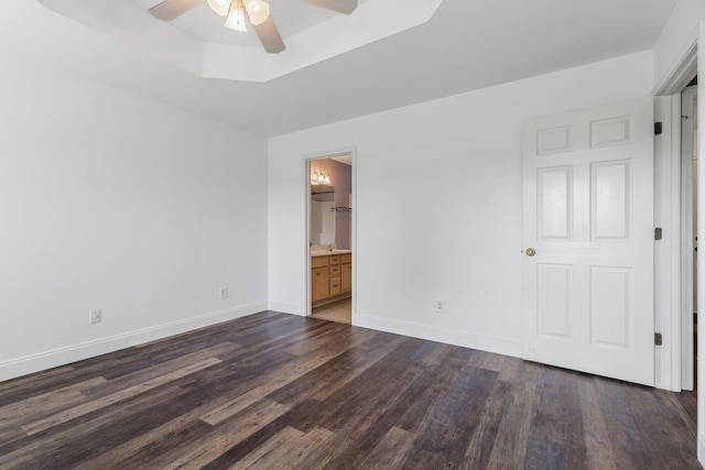 3406 Meadowhill Dr, Murfreesboro, TN 37130 - unfurnished bedroom with dark wood-type flooring, a raised ceiling, ensuite bathroom, and ceiling fan