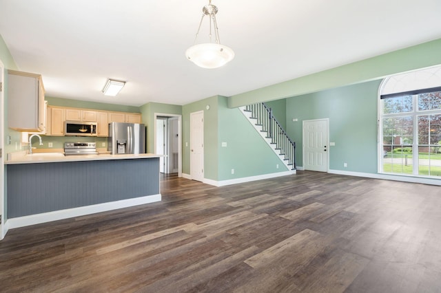 3406 Meadowhill Dr, Murfreesboro, TN 37130 - kitchen featuring appliances with stainless steel finishes, open floor plan, dark wood-style floors, light countertops, and a peninsula