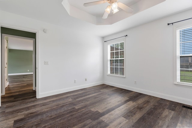 3406 Meadowhill Dr, Murfreesboro, TN 37130 - unfurnished room featuring dark wood finished floors, plenty of natural light, a ceiling fan, and a tray ceiling