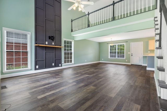3406 Meadowhill Dr, Murfreesboro, TN 37130 - unfurnished living room featuring a high ceiling, a ceiling fan, and dark wood-style flooring
