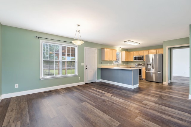 3406 Meadowhill Dr, Murfreesboro, TN 37130 - kitchen featuring appliances with stainless steel finishes, light brown cabinetry, a peninsula, light countertops, and dark wood-style flooring