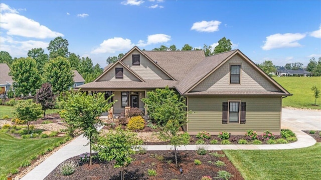 180 Jasper Springs Dr, Jasper, TN 37347 - craftsman house featuring a front lawn, covered porch, and a shingled roof
