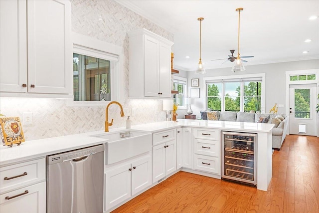 180 Jasper Springs Dr, Jasper, TN 37347 - kitchen with stainless steel dishwasher, wine cooler, ceiling fan, open floor plan, and light wood finished floors