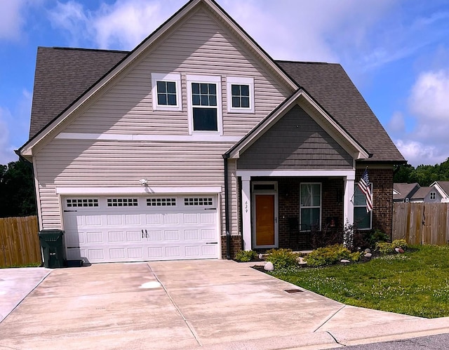 629 Whirlaway Dr, Burns, TN 37029 - view of front of house featuring brick siding, driveway, a shingled roof, and an attached garage