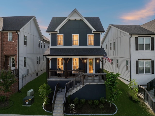 234 Sounder Cir, La Vergne, TN 37086 - view of front of house featuring stairs, covered porch, board and batten siding, a front yard, and roof with shingles