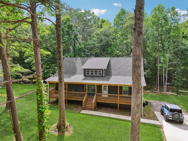 122 Deerwood Ct, Dickson, TN 37055 - chalet / cabin with a front yard and a shingled roof