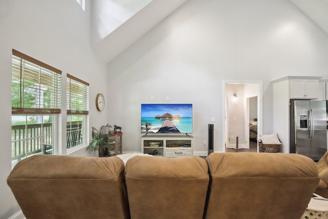 122 Deerwood Ct, Dickson, TN 37055 - living area featuring high vaulted ceiling and baseboards
