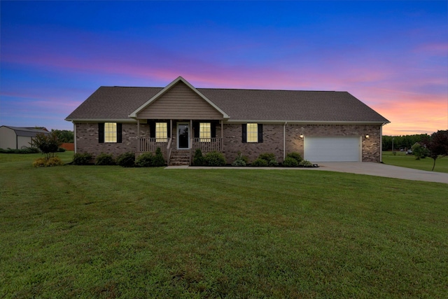288 Springwater Dr, Summertown, TN 38483 - ranch-style house with driveway, a porch, an attached garage, and a lawn