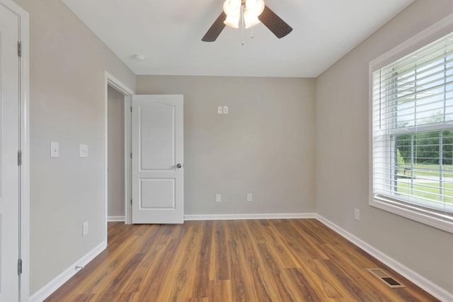 288 Springwater Dr, Summertown, TN 38483 - unfurnished room with ceiling fan, plenty of natural light, wood finished floors, and a smoke detector