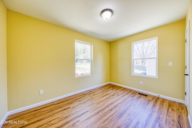 1112 Brookside Ave, Maryville, TN 37804 - empty room with plenty of natural light and wood finished floors