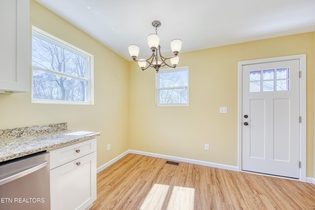 1112 Brookside Ave, Maryville, TN 37804 - unfurnished dining area featuring light wood-style floors and a chandelier