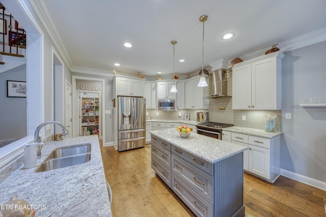 2023 Legacy Ln, Maryville, TN 37803 - kitchen featuring stainless steel appliances, wall chimney exhaust hood, ornamental molding, white cabinets, and gray cabinetry