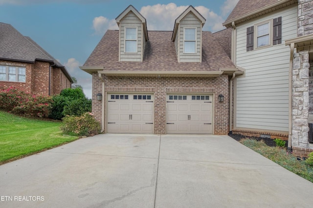 2023 Legacy Ln, Maryville, TN 37803 - view of front of house with brick siding, roof with shingles, driveway, a garage, and a front lawn