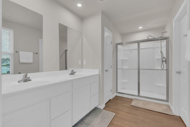 1830 Quail Run Way, Spring Hill, TN 37174 - bathroom featuring wood finished floors, double vanity, an enclosed shower, and recessed lighting