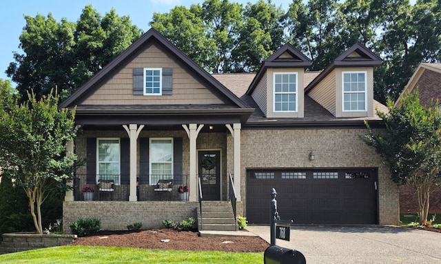 768 Masters Way, Mount Juliet, TN 37122 - view of front of house featuring a porch, driveway, brick siding, a garage, and roof with shingles