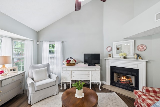 306 Norvich Ct, Franklin, TN 37069 - living room featuring high vaulted ceiling, wood finished floors, a lit fireplace, and a ceiling fan
