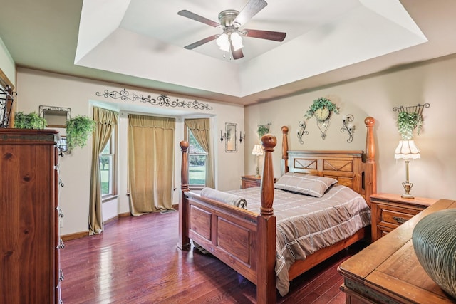 10615 Owens Chapel Rd, Springfield, TN 37172 - bedroom with dark wood-style floors, a raised ceiling, and ceiling fan