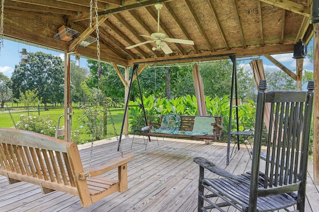 10615 Owens Chapel Rd, Springfield, TN 37172 - deck with a ceiling fan, view of scattered trees, and a yard