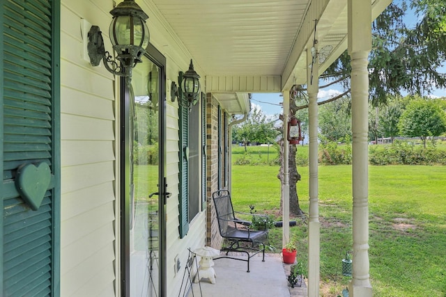 10615 Owens Chapel Rd, Springfield, TN 37172 - covered porch featuring a yard