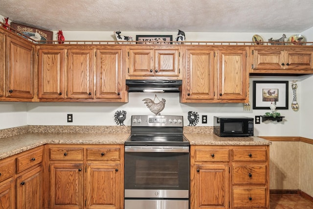 10615 Owens Chapel Rd, Springfield, TN 37172 - kitchen featuring stainless steel range with electric stovetop, under cabinet range hood, black microwave, light countertops, and a textured ceiling