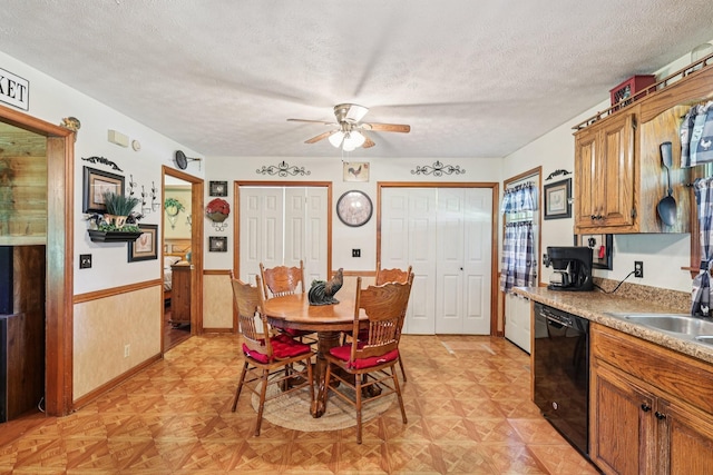 10615 Owens Chapel Rd, Springfield, TN 37172 - dining space featuring ceiling fan, wainscoting, and a textured ceiling