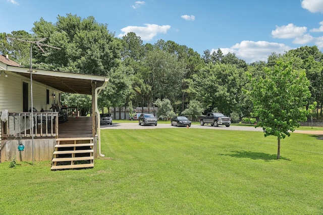 10615 Owens Chapel Rd, Springfield, TN 37172 - view of green lawn featuring view of scattered trees and a wooden deck