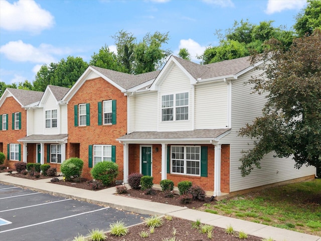 3220 Prater Ct, Murfreesboro, TN 37128 - view of property with brick siding, uncovered parking, and a shingled roof