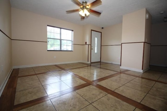 1211 Patton Pl, Oak Grove, KY 42262 - empty room with inlaid floor details, tile patterned flooring, and ceiling fan