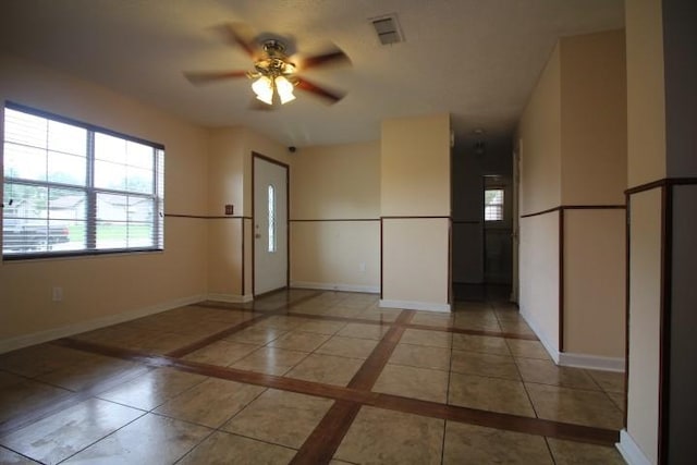 1211 Patton Pl, Oak Grove, KY 42262 - spare room with ceiling fan, healthy amount of natural light, inlaid floor details, and light tile patterned floors