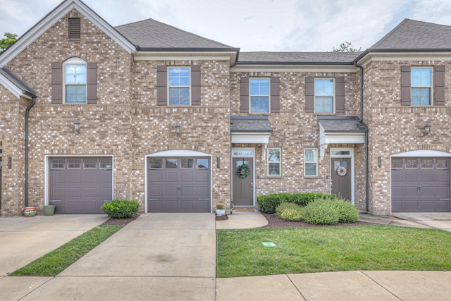 3105 Defilade Dr, Murfreesboro, TN 37128 - multi unit property featuring driveway, an attached garage, brick siding, and roof with shingles