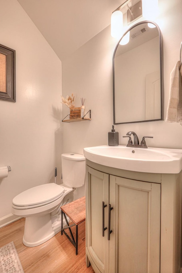 3105 Defilade Dr, Murfreesboro, TN 37128 - half bath featuring wood finished floors, vanity, and vaulted ceiling