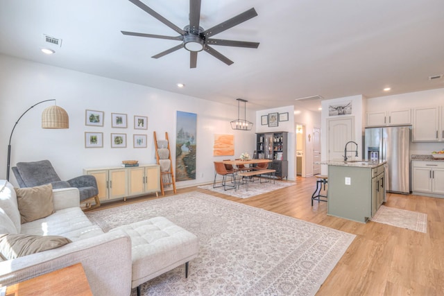 3105 Defilade Dr, Murfreesboro, TN 37128 - living area featuring ceiling fan, light wood-style floors, and recessed lighting