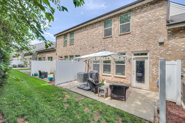 3105 Defilade Dr, Murfreesboro, TN 37128 - rear view of property featuring brick siding and a patio area