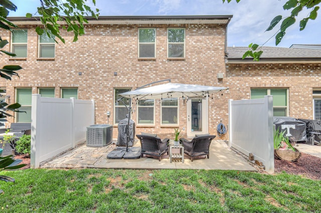 3105 Defilade Dr, Murfreesboro, TN 37128 - rear view of house with a patio area, brick siding, and an outdoor hangout area