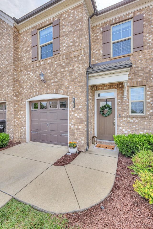 3105 Defilade Dr, Murfreesboro, TN 37128 - view of front of home with brick siding, an attached garage, and driveway