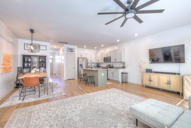 3105 Defilade Dr, Murfreesboro, TN 37128 - living room with light wood-style flooring, a ceiling fan, and recessed lighting