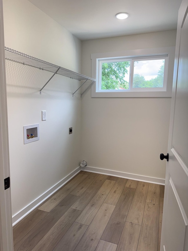 825A College St, Portland, TN 37148 - laundry room featuring hookup for an electric dryer, hookup for a washing machine, wood finished floors, and recessed lighting
