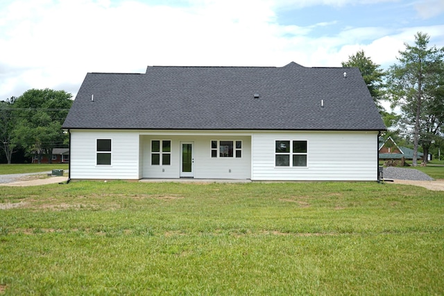 825A College St, Portland, TN 37148 - rear view of house with a lawn and roof with shingles
