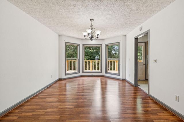 5531 Willow Oak Dr, Baxter, TN 38544 - unfurnished dining area with a chandelier, wood finished floors, and a textured ceiling