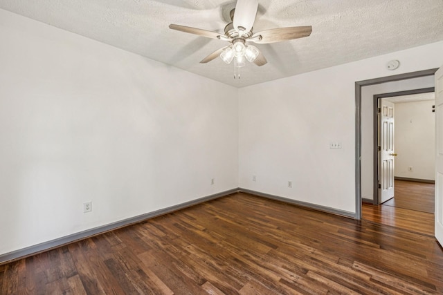 5531 Willow Oak Dr, Baxter, TN 38544 - spare room featuring a smoke detector, a ceiling fan, dark wood-style flooring, and a textured ceiling