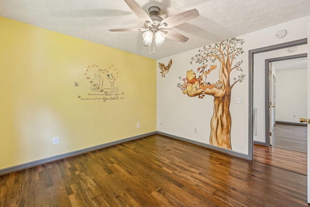 5531 Willow Oak Dr, Baxter, TN 38544 - unfurnished room featuring a textured ceiling, a ceiling fan, a smoke detector, and wood finished floors