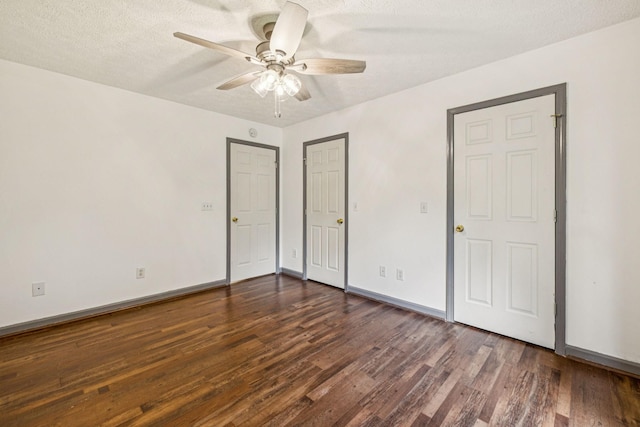 5531 Willow Oak Dr, Baxter, TN 38544 - unfurnished bedroom featuring dark wood-type flooring, a textured ceiling, and ceiling fan