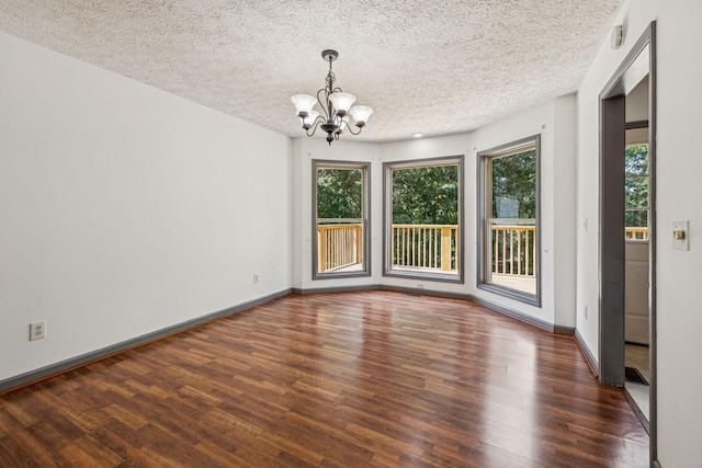 5531 Willow Oak Dr, Baxter, TN 38544 - spare room with a chandelier, wood finished floors, and a textured ceiling