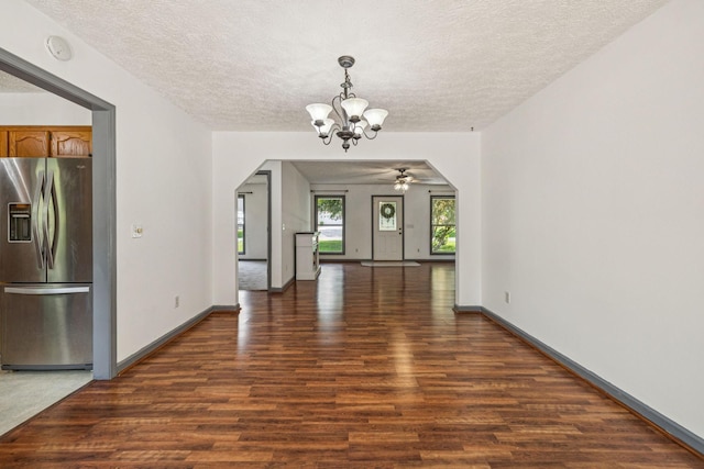 5531 Willow Oak Dr, Baxter, TN 38544 - unfurnished dining area with a textured ceiling, wood finished floors, a chandelier, arched walkways, and ceiling fan
