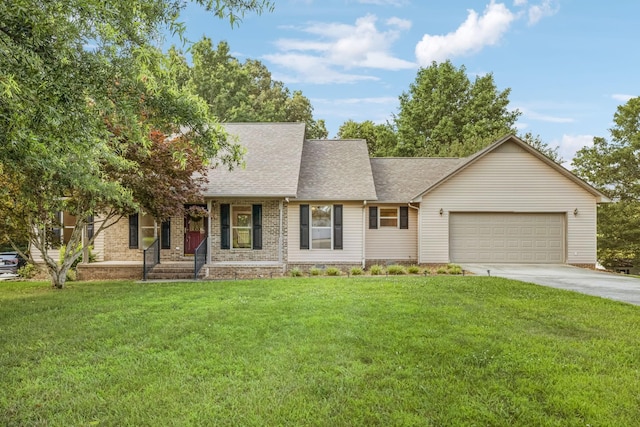 5531 Willow Oak Dr, Baxter, TN 38544 - view of front of property with a garage, concrete driveway, roof with shingles, a front yard, and brick siding