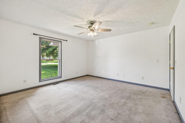 5531 Willow Oak Dr, Baxter, TN 38544 - spare room featuring a ceiling fan, carpet, a textured ceiling, and a smoke detector