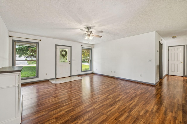 5531 Willow Oak Dr, Baxter, TN 38544 - unfurnished living room with dark wood-style flooring, ceiling fan, and a textured ceiling