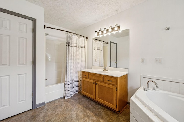 5531 Willow Oak Dr, Baxter, TN 38544 - bathroom featuring vanity, a textured ceiling, and tiled shower / bath combo