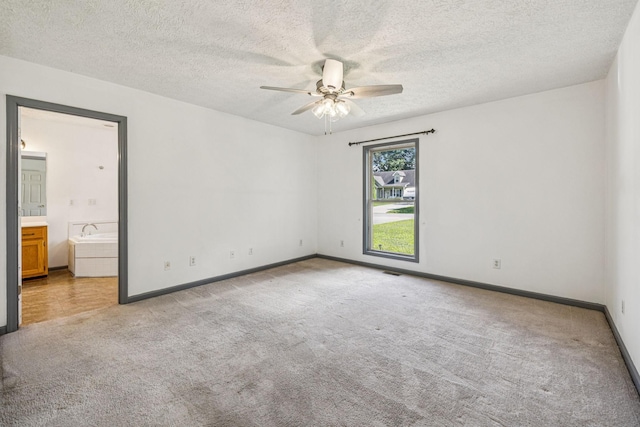 5531 Willow Oak Dr, Baxter, TN 38544 - empty room with carpet, a ceiling fan, and a textured ceiling