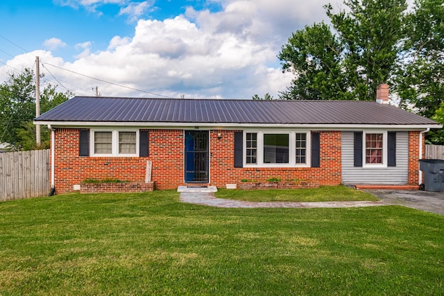 404 Mullican St, Mcminnville, TN 37110 - view of front of home with a metal roof, brick siding, and a chimney